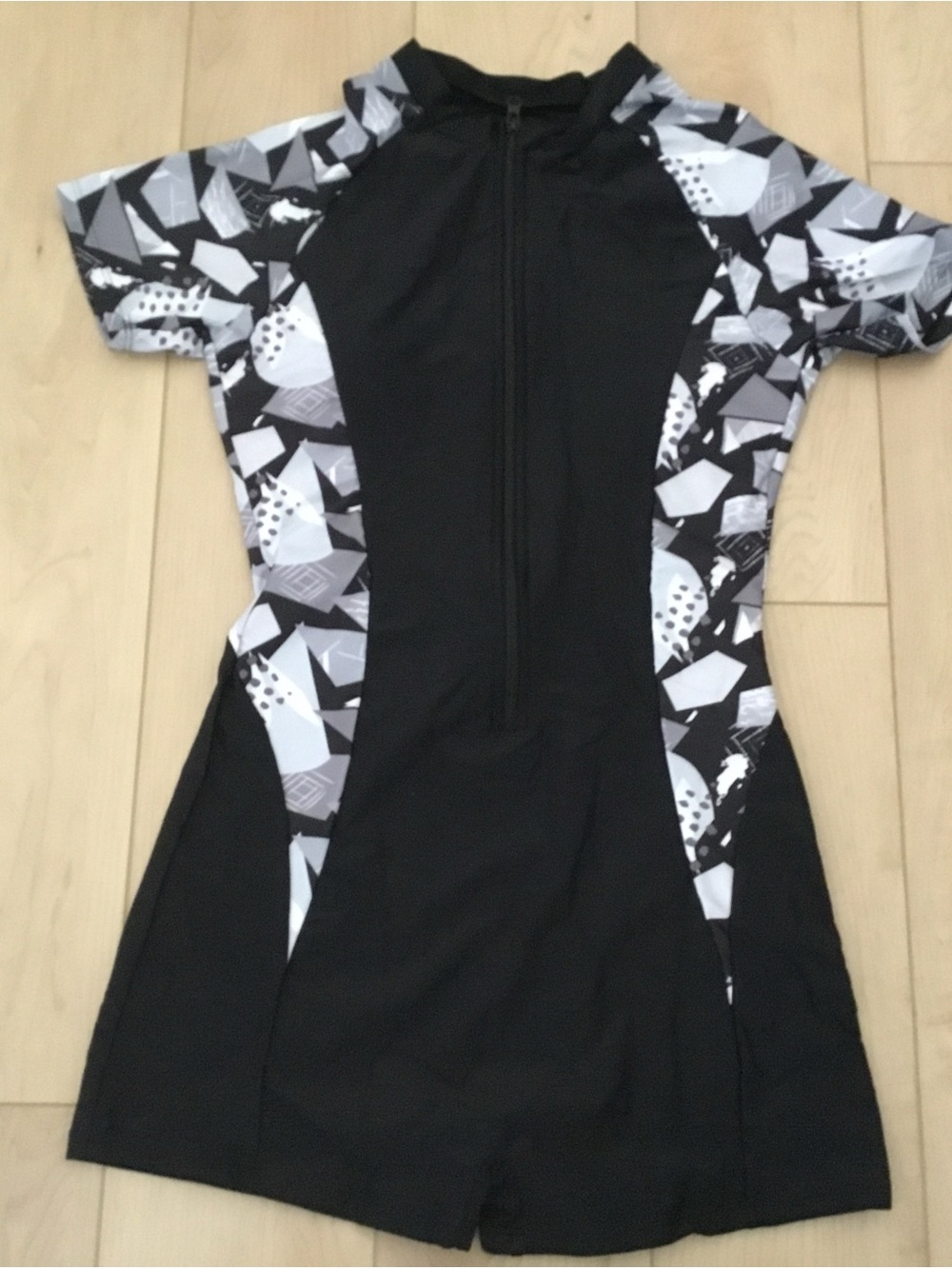 Black Short-Sleeve Zip Front Swimsuit with Monochrome Geometric Panels